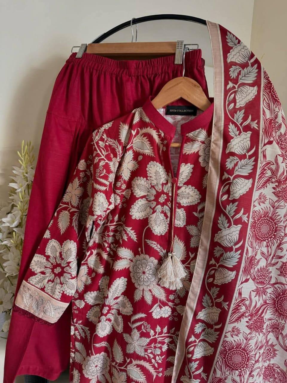 Red kurta set with white floral embroidery, matching pants, and printed dupatta
